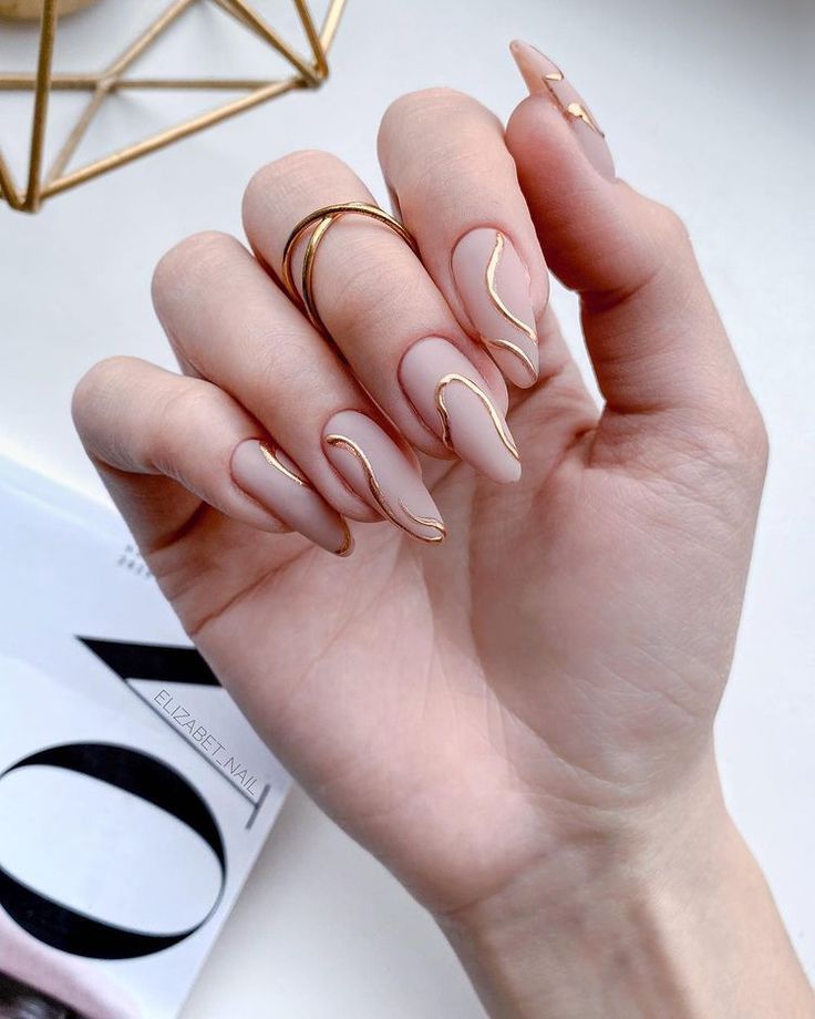 almond nails with golden lines