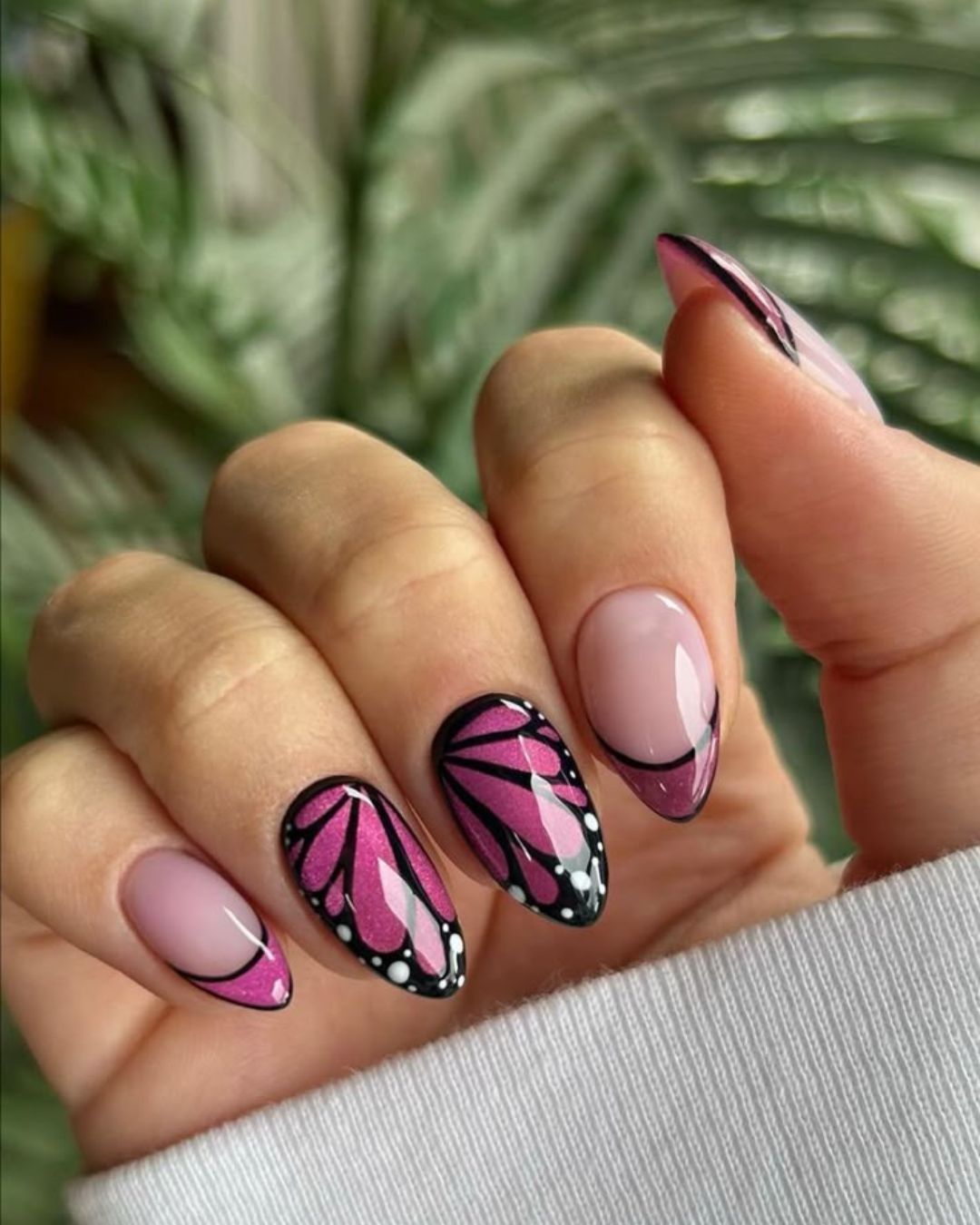 Butterfly inspired pink and black nails